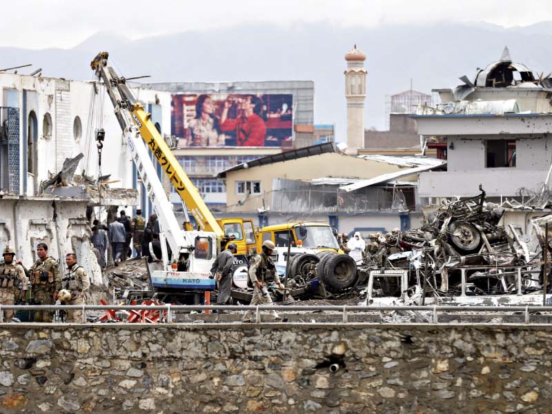 afghan security forces inspect the site of the suicide car bomb attack in kabul photo reuters