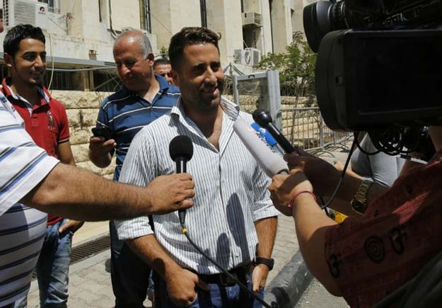 ali al amin whose ex wife tried to abduct their children talks to the press as he leaves the court in baabda northeast of beirut on april 20 2016 photo afp