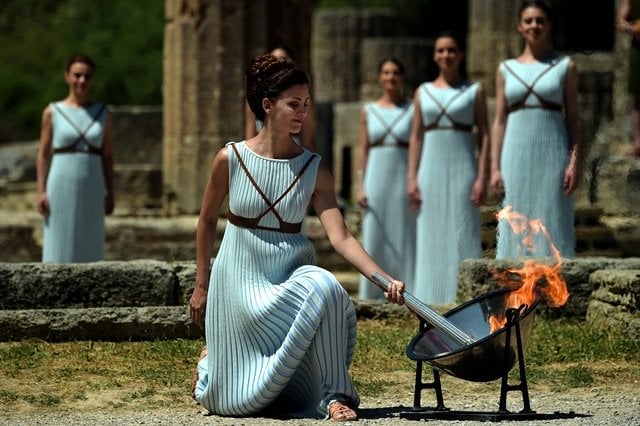 actress katerina lechou acting as the high priestess lights the olympic flame at the temple of hera on april 21 2016 in ancient olympia the sanctuary where the olympic games were born in 776 bc photo afp