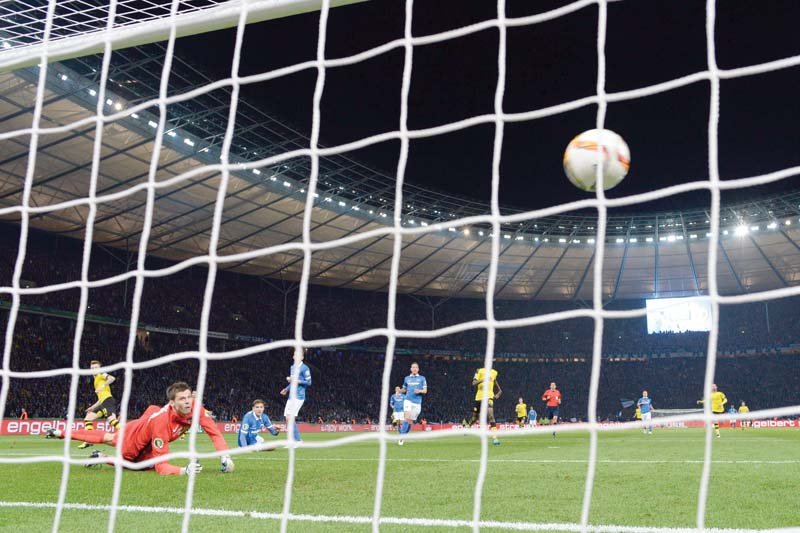 hertha s norwegian goalkeeper rune jarstein l looks on as reus s strike nestles into the net to give dortmund a 2 0 lead that settled any remaining nerves photo afp