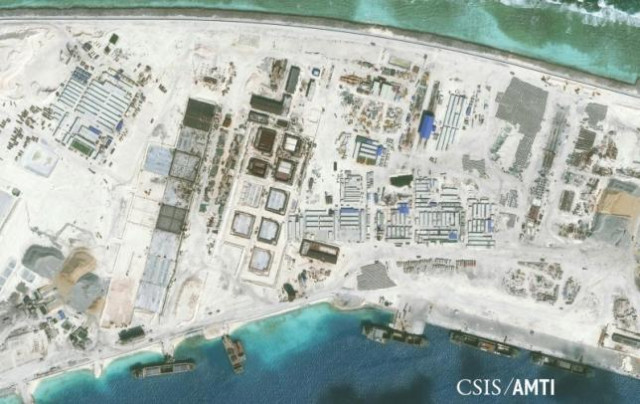 the northwest side of mischief reef showing a 1 900 foot seawall and newly constructed infrastructure including housing an artificial turf parade grounds cement plants and docking facilities are shown in this center for strategic and international studies csis asia photo reuters the northwest side of mischief reef showing a 1 900 foot seawall and newly constructed infrastructure including housing an artificial turf parade grounds cement plants and docking facilities are shown in this center for strategic and international studies csis asia photo reuters