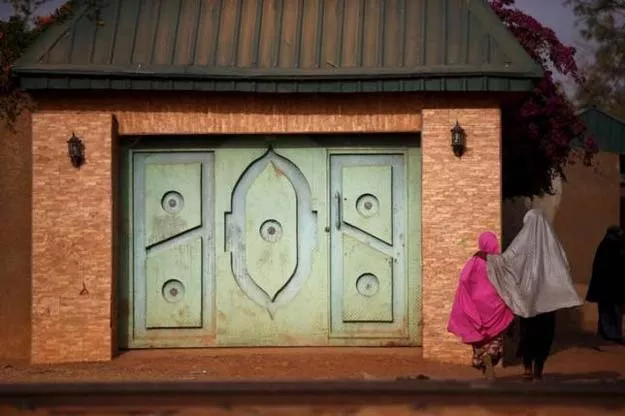 two girls dressed in hijabs walk away from a house along the railway line in zaria in kaduna state nigeria february 2 2016 photo reuters two girls dressed in hijabs walk away from a house along the railway line in zaria in kaduna state nigeria february 2 2016 photo reuters