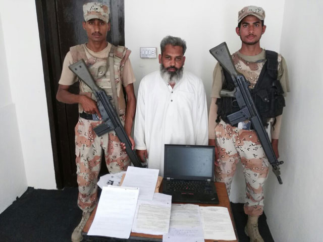 muhammad ashfaq was caught red handed with solved copies of matriculation exam papers in karachi say rangers photo sindh rangers