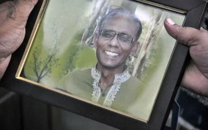 a man holds a portrait of bangladeshi professor rezaul karim siddique who was hacked to death by unidentified attackers in rajshahi photo afp a man holds a portrait of bangladeshi professor rezaul karim siddique who was hacked to death by unidentified attackers in rajshahi photo afp