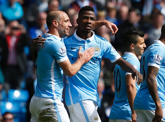 kelechi iheanacho celebrates with pablo zabaleta l after scoring manchester city 039 s third goal against stoke city at the etihad stadium in manchester england on april 23 2016 photo afp