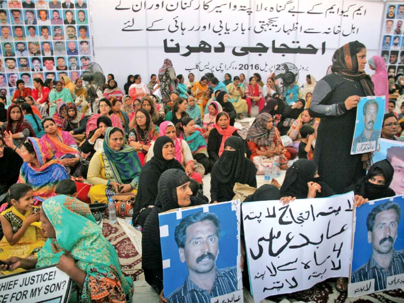 family of missing mqm workers along with senior party leaders held a sit in at the karachi press club in hopes of ascertaining their whereabouts photo athar khan express