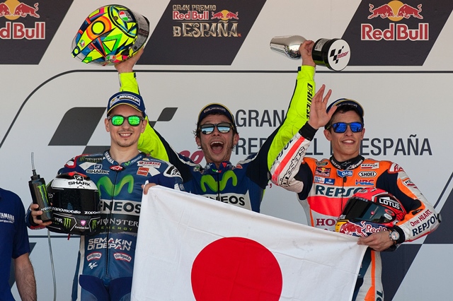 valentino rossi c celebrates his victory between jorge lorenzo l and marc marquez r on the podium after motogp race during the spanish moto grand prix in jerez de la frontera on april 24 2016 photo afp