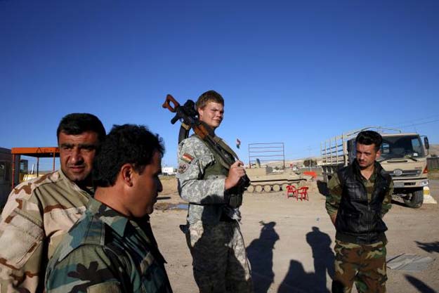 us volunteer john cole c 23 carries his assault rifle at a checkpoint in makhmour iraq april 17 2016 photo reuters