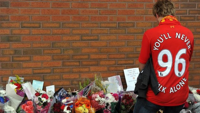 a liverpool fan pays his respects outside anfield to the 96 supporters who died in the 1989 hillsborough disaster photo afp a liverpool fan pays his respects outside anfield to the 96 supporters who died in the 1989 hillsborough disaster photo afp