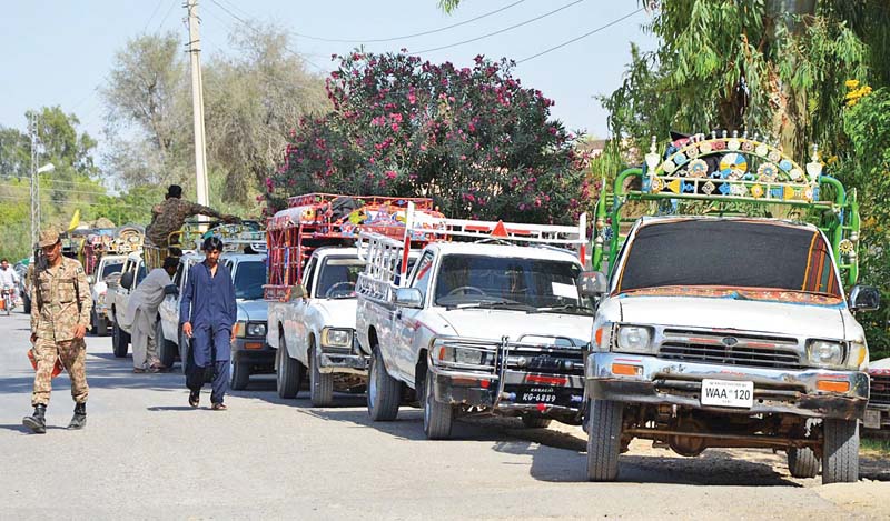 election officials in dhahdhar town load polling material on vehicles headed for various polling stations for by elections in jhal magsi constituency of na 267 pti balochistan organiser yar mohammad rind will face pml n candidate khalid magsi for the seat photo online