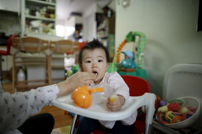 jeong bo mi 37 among a group of south korean parents who sued a post partum care centre seeking compensation after babies were infected with latent tuberculosis takes care of her baby who was not infected but was treated as a preventive measure at her home in seoul photo reuters