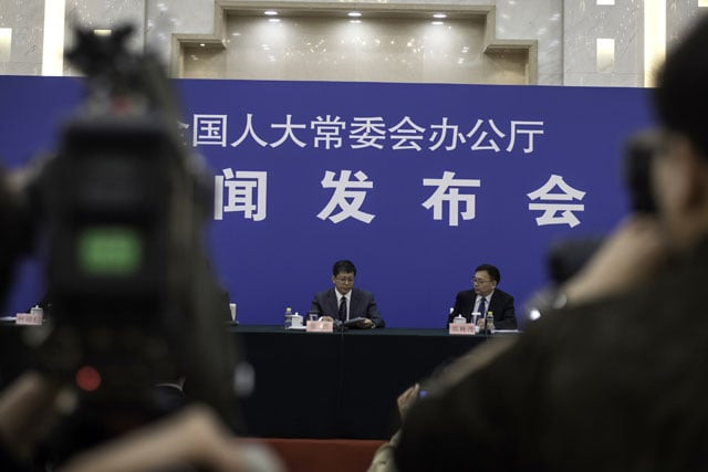 chinese authorities arrive for a press conference at the great hall of people in beijing on april 28 2016 photo afp chinese authorities arrive for a press conference at the great hall of people in beijing on april 28 2016 photo afp