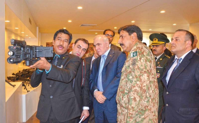 azerbaijan s defence minister colonel general zakir hasanov being briefed about pof manufactured gun during visit photo inp azerbaijan s defence minister colonel general zakir hasanov being briefed about pof manufactured gun during visit photo inp