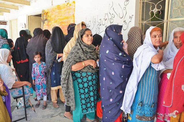 women wait to cast their votes at a polling station in dera allahyar during by elections for na267 constituency in balochistan photo online