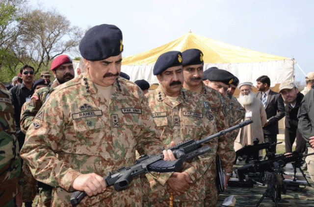chief of army staff general raheel sharif inspects a weapon during his visit to the pakistan ordnance factory in wah on march 15 2016 photo ispr