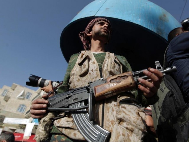 a tribal gunman loyal to the shia huthi movement holds his weapon on april 16 2015 in the capital sanaa photo afp