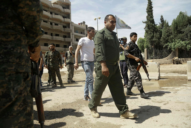 jowan ibrahim c the commander of the kurdish police known as the asayish arrives at a checkpoint where a suicide bomber killed five kurdish policemen on april 30 2016 in syria 039 s divided northeastern city of qamishli photo afp