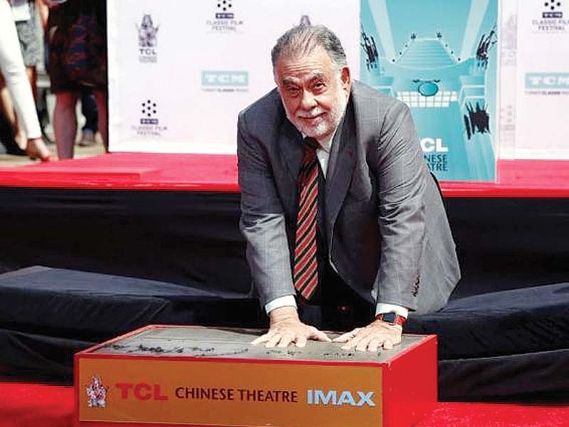 director francis ford coppola places his handprints in cement during a ceremony in the forecourt of the tcl chinese theatre in hollywood photo reuters