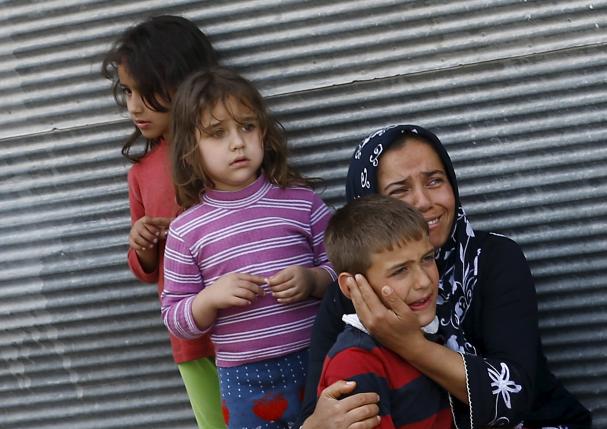 a mother and her children react after two rockets hit the turkish town of kilis near the syrian border turkey april 24 2016 photo reuters