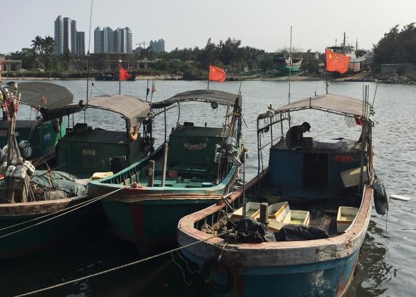 fishing boats with chinese national flags are seen at a harbour in tanmen hainan province april 5 2016 photo reuters