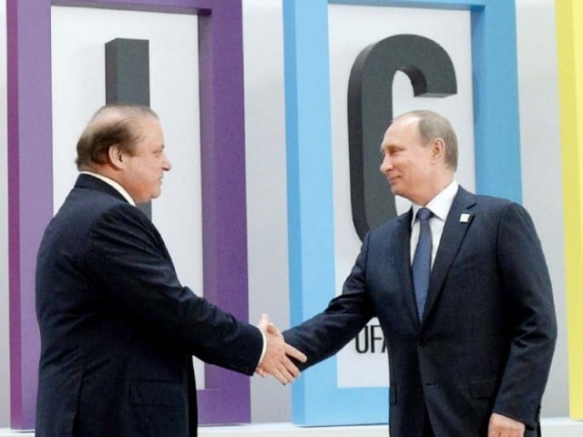 russian president vladimir putin greets pm nawaz sharif on his arrival at the 7th brics summit photo pid