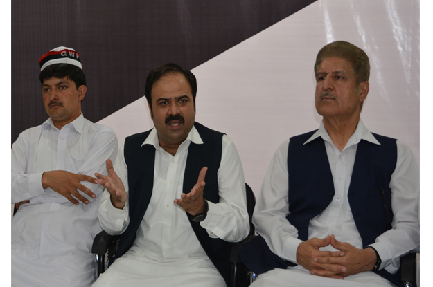 qaumi watan party k p president sikandar hayat sherpao addressing a press conference at his office photo express