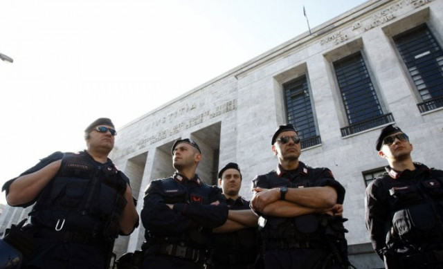 in this file photo italy 039 s carabinieri police officers stand outside milan 039 s court on april 6 2011 photo reuters in this file photo italy 039 s carabinieri police officers stand outside milan 039 s court on april 6 2011 photo reuters