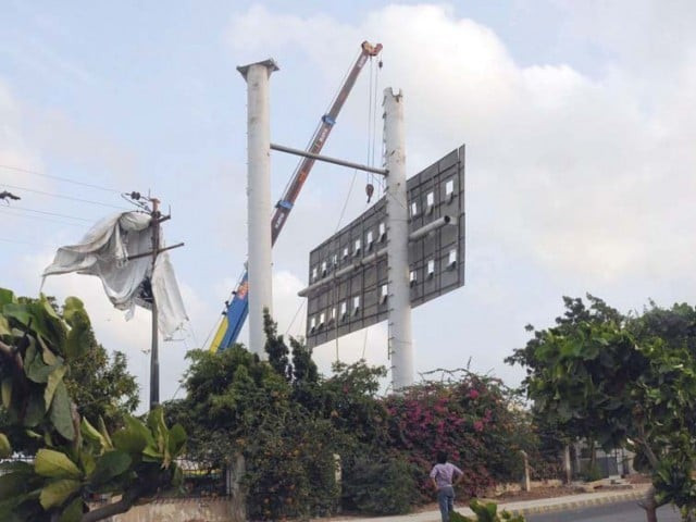 advertiser says pda removed hoardings though he had permission from city district administration photo file advertiser says pda removed hoardings though he had permission from city district administration photo file