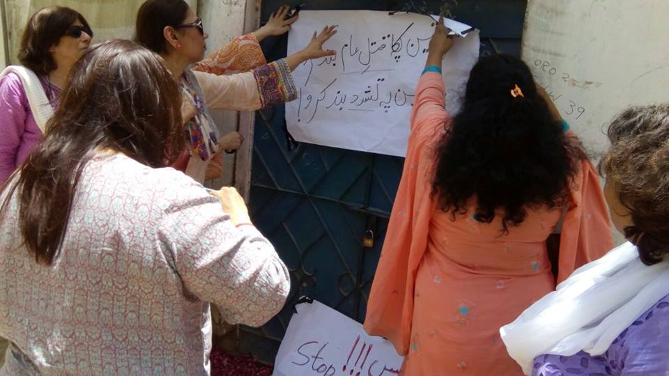 women action forum activists raise a poster against a recent case of honour killing in karachi photo courtesy waf