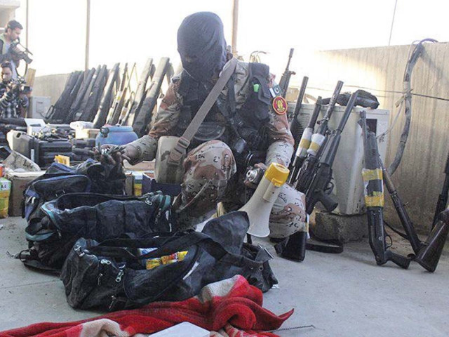 a rangers soldier displays weapons seized during the march 11 raid photo file a rangers soldier displays weapons seized during the march 11 raid photo file