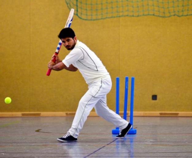 an afghan refugee takes part in a cricket training session at the team of the altendorf 09 blue tigers in essen western germany on april 30 2016 photo afp