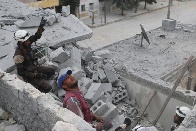 civil defense members work at a site hit by an airstrike in the rebel held area of aleppo 039 s baedeen district syria may 3 2016 photo reuters