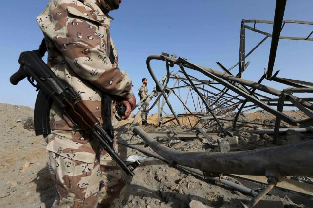 members of palestinian security forces loyal to hamas survey a hamas site after it was hit by an israeli airstrike in rafah in the southern gaza strip may 27 2015 photo reuters