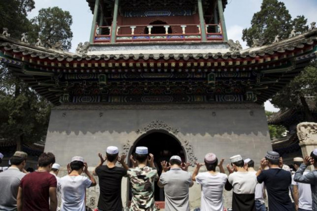 muslim believers pray at the historic niujie mosque as they celebrate the eid al fitr in beijing july 18 2015 photo reuters muslim believers pray at the historic niujie mosque as they celebrate the eid al fitr in beijing july 18 2015 photo reuters