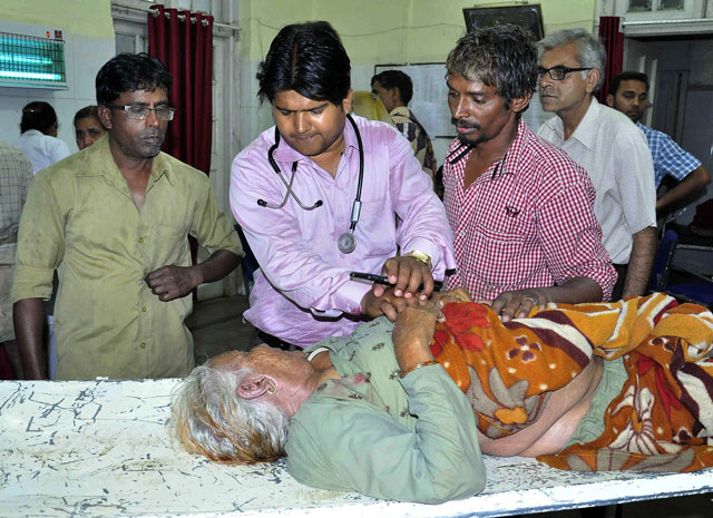 an indian pilgrim injured after a tent collapse caused a stampede at a religious event is treated by medical staff at a hopsital in ujjain on may 5 2016