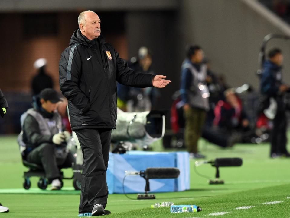 guangzhou evergrande head coach luiz felipe scolari gestures during their club world cup football semi final match against barcelona in yokohama on december 17 2015 photo afp