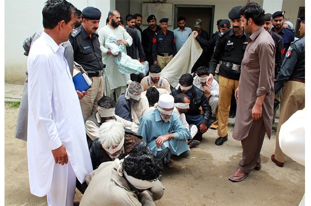 policemen showing jirga members who allegedly burnt alive 16 year old ambreen photo online