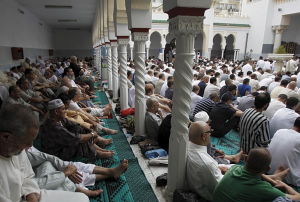 worshippers attend morning prayers of eid al fitr holiday marking the end of the holy month of ramadan at al biar mosque in algiers algeria july 17 2015 photo reuters