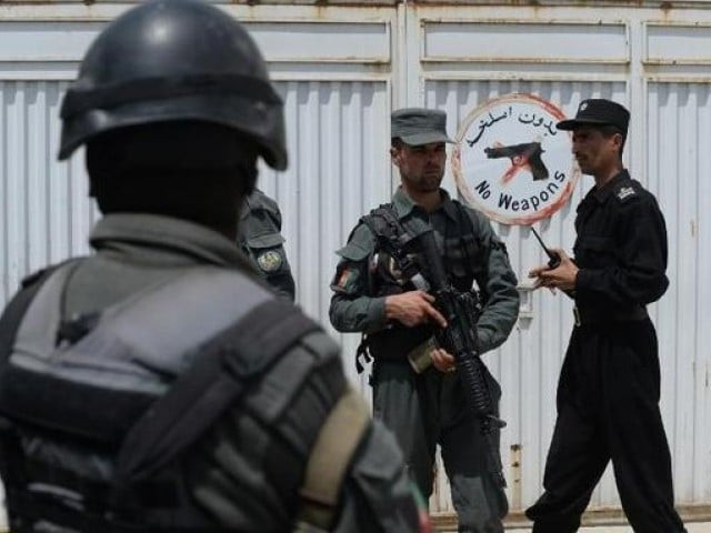 afghan police stand guard at the gate of the cure international hospital in kabul on april 24 2014 after a gunman killed three americans photo afp afghan police stand guard at the gate of the cure international hospital in kabul on april 24 2014 after a gunman killed three americans photo afp
