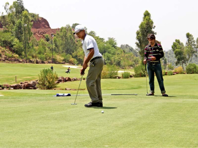 a golfer plays a shot during the 6th chairman bahria town open golf championship photo pr a golfer plays a shot during the 6th chairman bahria town open golf championship photo pr