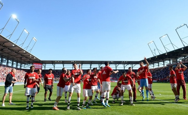 bayern munich players celebrate wining the league for the fourth year in a row after the german first division bundesliga football match between fc ingolstadt 04 and fc bayern munich at the audi sportpark in ingolstadt southern germany photo afp bayern munich players celebrate wining the league for the fourth year in a row after the german first division bundesliga football match between fc ingolstadt 04 and fc bayern munich at the audi sportpark in ingolstadt southern germany photo afp