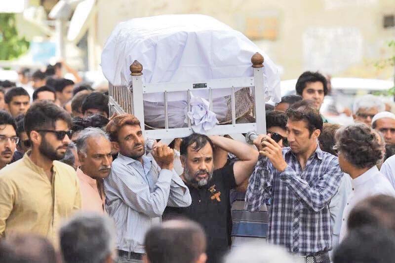 slain activist khurram zaki shoulders the coffin of sabeen mahmud the director of t2f after she was gunned down by armed assailants last year photo courtesy social media