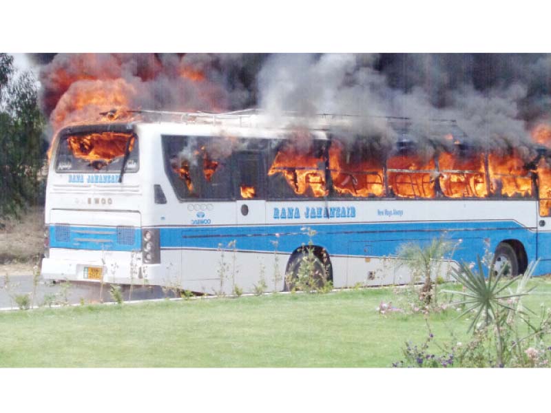 the bus torched by protesters in bhakkar photo ikram paracha express