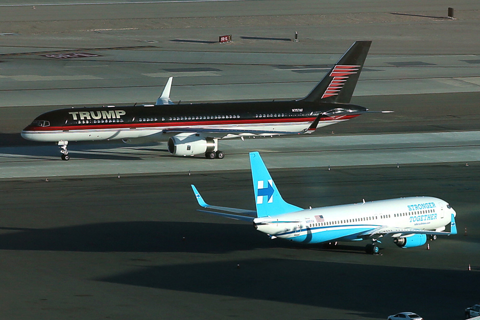 US Republican presidential nominee Donald Trump's campaign plane (rear) passes US Democratic presidential nominee Hillary Clinton's campaign plane as it lands in Las Vegas, Nevada, US. PHOTO: REUTERS