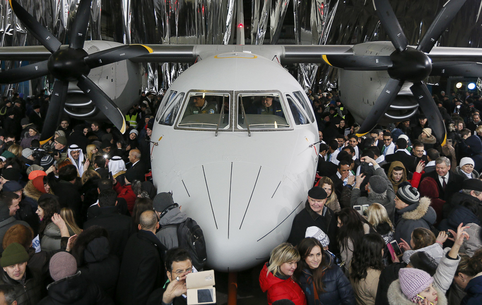 People surround a new An-132D cargo plane during its presentation at the Antonov aircraft plant in Kiev, Ukraine. PHOTO: REUTERS