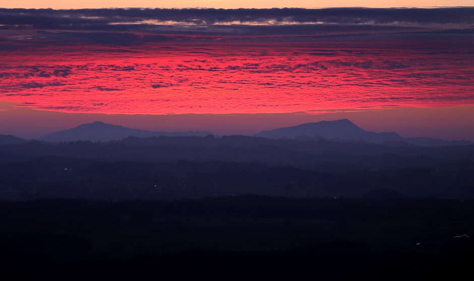 red clouds are pictured at the sunset in the alpine foothills in southern germany photo afp