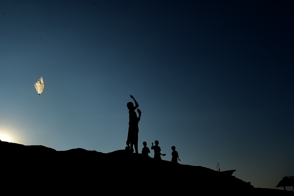 Rohingya Muslim refugee children fly kites at Balukhali refugee camp in the Ukhia district of Bangladesh. PHOTO: AFP