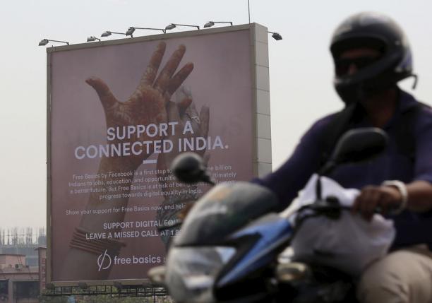 a motorist rides past a billboard displaying facebook 039 s free basics initiative in mumbai india december 30 2015 photo reuters