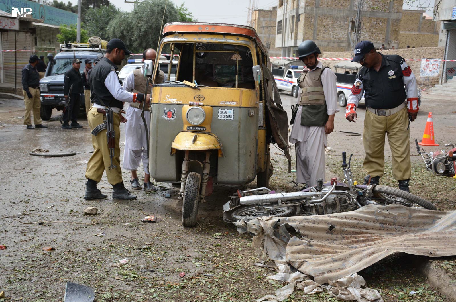 police inspect the blast site in quetta on tuesday photo inp