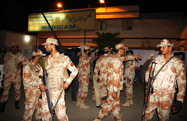 rangers personnel standing on alert during a raid in a karachi area photo online